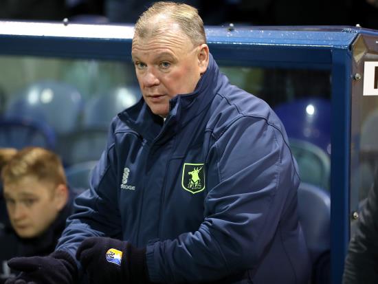 Steve Evans lauds Mansfield after crucial victory at Exeter