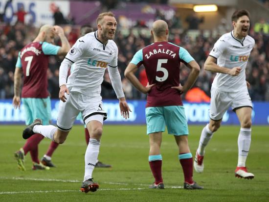 Swansea ease relegation worries with thumping win over West Ham