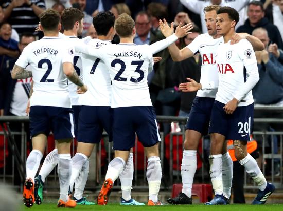Pochettino proud of players after securing Champions League place
