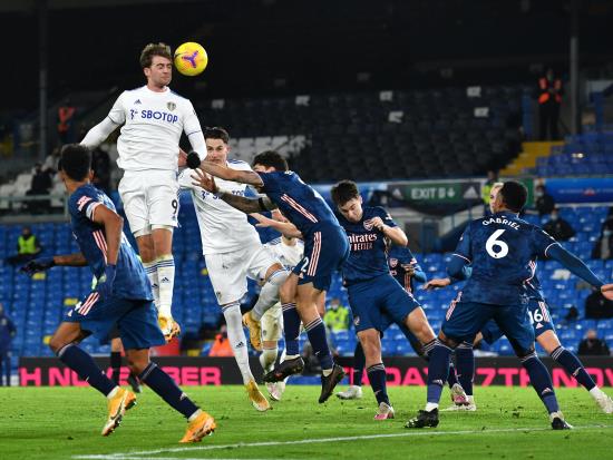 Goal frame denies Leeds three times as 10-man Arsenal hold on for a point