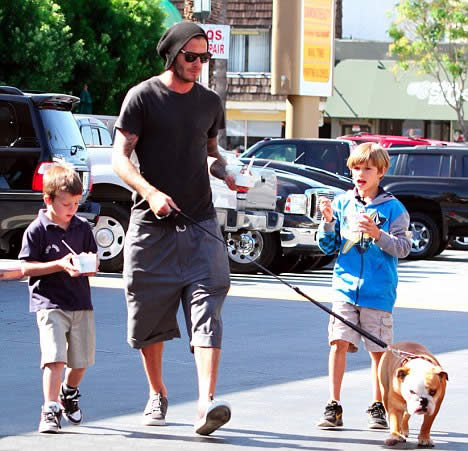 On the road again: After his car crash David Beckham treats the boys to ice cream before chauffeuring pregnant Posh to dinner