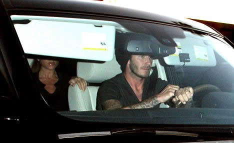 On the road again: After his car crash David Beckham treats the boys to ice cream before chauffeuring pregnant Posh to dinner