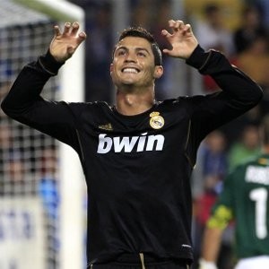 Ronaldo fires Real top, Barca held
