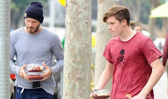 Time for cake! David Beckham and son Brooklyn head home with dessert after working out
