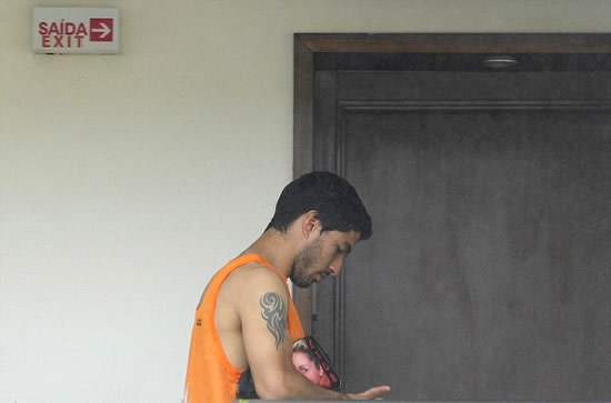 A broken-looking Luis Suarez pictured at Uruguay team hotel after learning of his 4-month ban from football