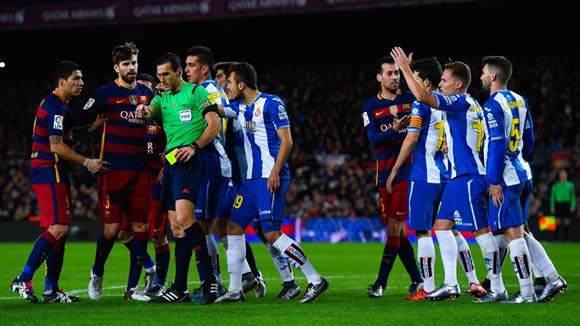 Barca's Suarez banned for two cup games over insults