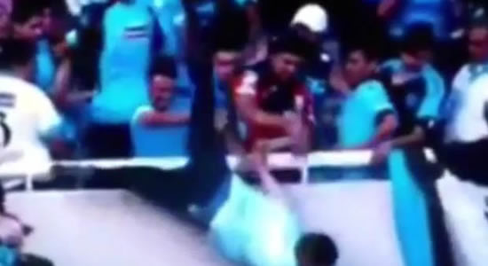 Footie fan suffers brain damage after his OWN team throw him over the stands in horror vid