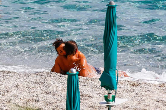 Chelsea boss Antonio Conte reads English football phrasebook as he lies on Italian beach in blue budgie smugglers