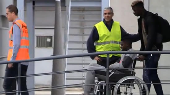 Dembele in wheelchair as he travels to Finland for surgery