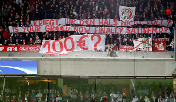 Bayern Munich fans launch fake money and unveil banner in protest at £89 tickets in Champions League match at Anderlecht