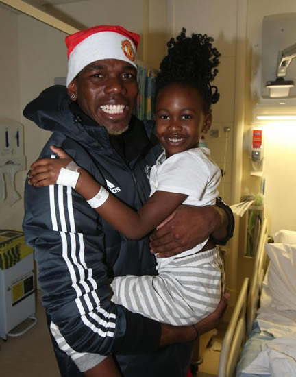Manchester United stars Paul Pogba and Zlatan Ibrahimovic make heartwarming Christmas trip to hospital to visit poorly kids