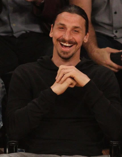 Zlatan Ibrahimovic sits courtside after meeting LA Lakers stars including the legendary Shaquille O'Neal