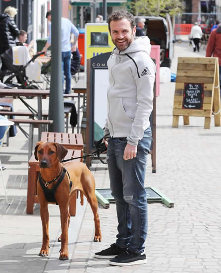 Manchester United ace Juan Mata puts on brave face as he walks his dog with partner Evelina Kampf despite being dropped by Jose Mourinho for Arsenal clash