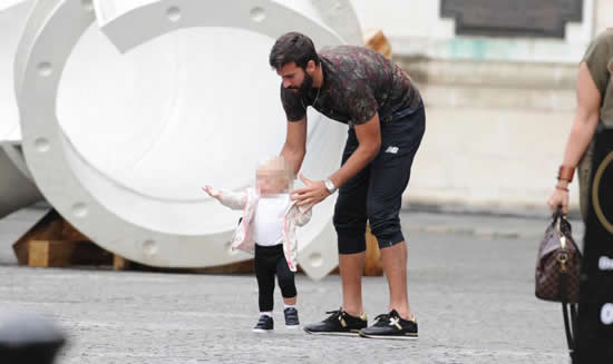 Liverpool keeper Alisson shows he's a safe pair of hands as he carries baby daughter out of restaurant on Merseyside