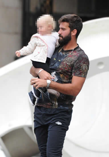 Liverpool keeper Alisson shows he's a safe pair of hands as he carries baby daughter out of restaurant on Merseyside