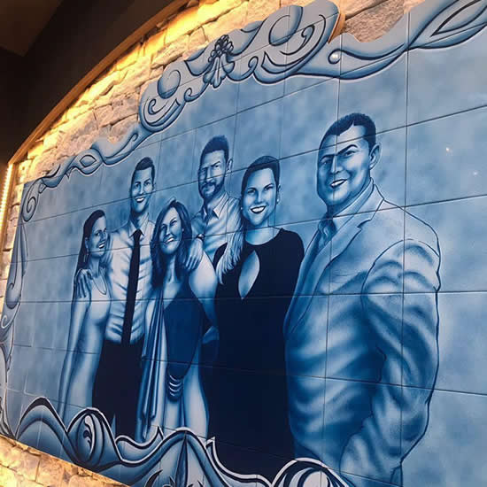 Cristiano Ronaldo reveals incredible family portrait in mother’s restaurant in Brazil… that was hand-painted by his sister