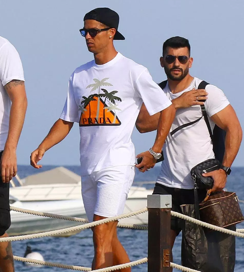 Cristiano Ronaldo visits St Tropez with partner Georgina Rodriguez clinging to her leopard print dress in high winds