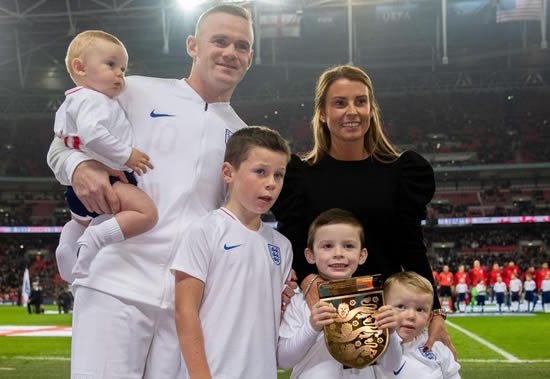 Wayne and Coleen Rooney get the kids in line wearing matching pyjamas for the annual family Christmas card