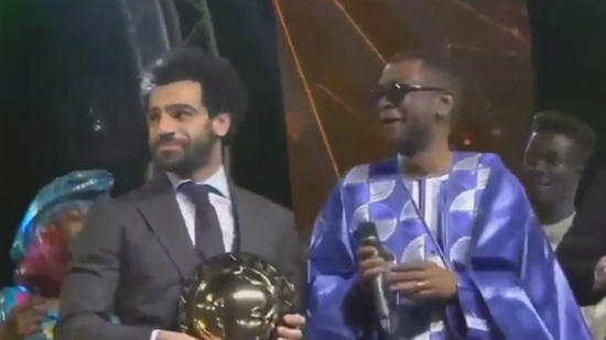 Cringe-worthy moment Mo Salah dances awkwardly on stage after winning award