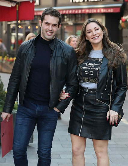 Kelly Brook flaunts legs in thigh-skimming leather miniskirt