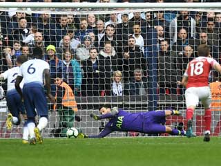 Tottenham 1 Arsenal 1: Lloris' late penalty save gives Spurs welcome relief