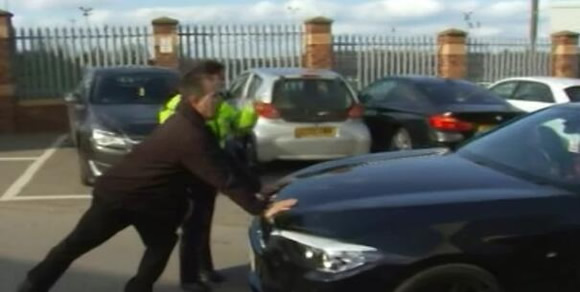 Police physically stop Joey Barton leaving ground after he is accused of assaulting Barnsley manager in post-match brawl