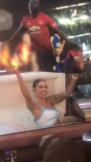 Female host bizarrely holds up Lukaku cut-out from inside a COFFIN as Man Utd striker parties at LA club