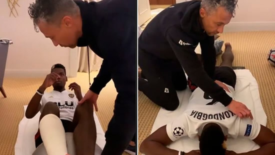 Pogba wears a Valencia shirt as he continues his recovery from injury