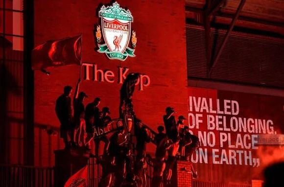 Liverpool fans break social distancing rules by gathering to enjoy Premier League title