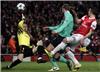 Barcelona's goalkeeper Victor Valdes blocks the ball in front of Arsenal's Robin van Persie Barcelona's Gerard Pique in north London