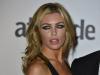 Abbey Clancy wears a sheer black gown and displays her side-boob at the Attitude Awards