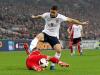 England's Gary Cahill skips a tackle from Poland's Adrian Mierzejewski