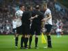 Helping hand: Referee Phil Dowd (2L) and Michael Dawson and Jan Vertonghen of Spurs speak to referee's assistant David Bryan after he was hit