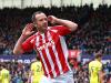 Charlie Adam seems to be having trouble hearing the Spurs fans after putting Stoke into the lead. 