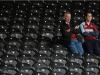 Burnley fans sit in their seats after they're relegated from the Premier League. 