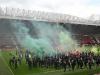 Fans stormed the pitch at Old Trafford before the game was called off yesterday Credit: AFP