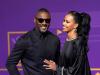 Star of the screen and big footie fan Idris Elba smiles with wife Sophia Makramati