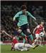 Arsenal's van Persie fights for the ball against Barcelona's Messi during their Champions League soccer match in London