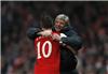 Robin van Persie of Arsenal celebrates with manager Arsene Wenger after scoring against Barcelona during their Champions League soccer match at the Emirates stadium in north London