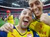 A selfie taken by Santi Cazorla of him and Mesut Ozil with Olivier Giroud watching on. 