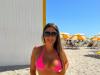 Claudia Romani shows off her figure in a pink bikini